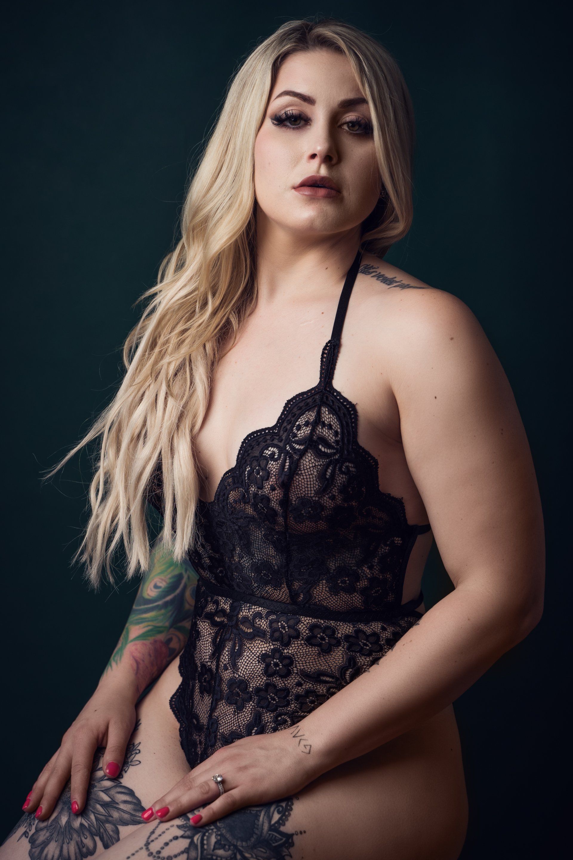 boudoir portrait of woman in black teddy