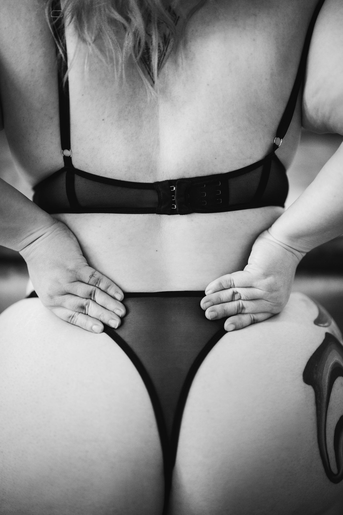 girl facing her butt and wearing black undies
