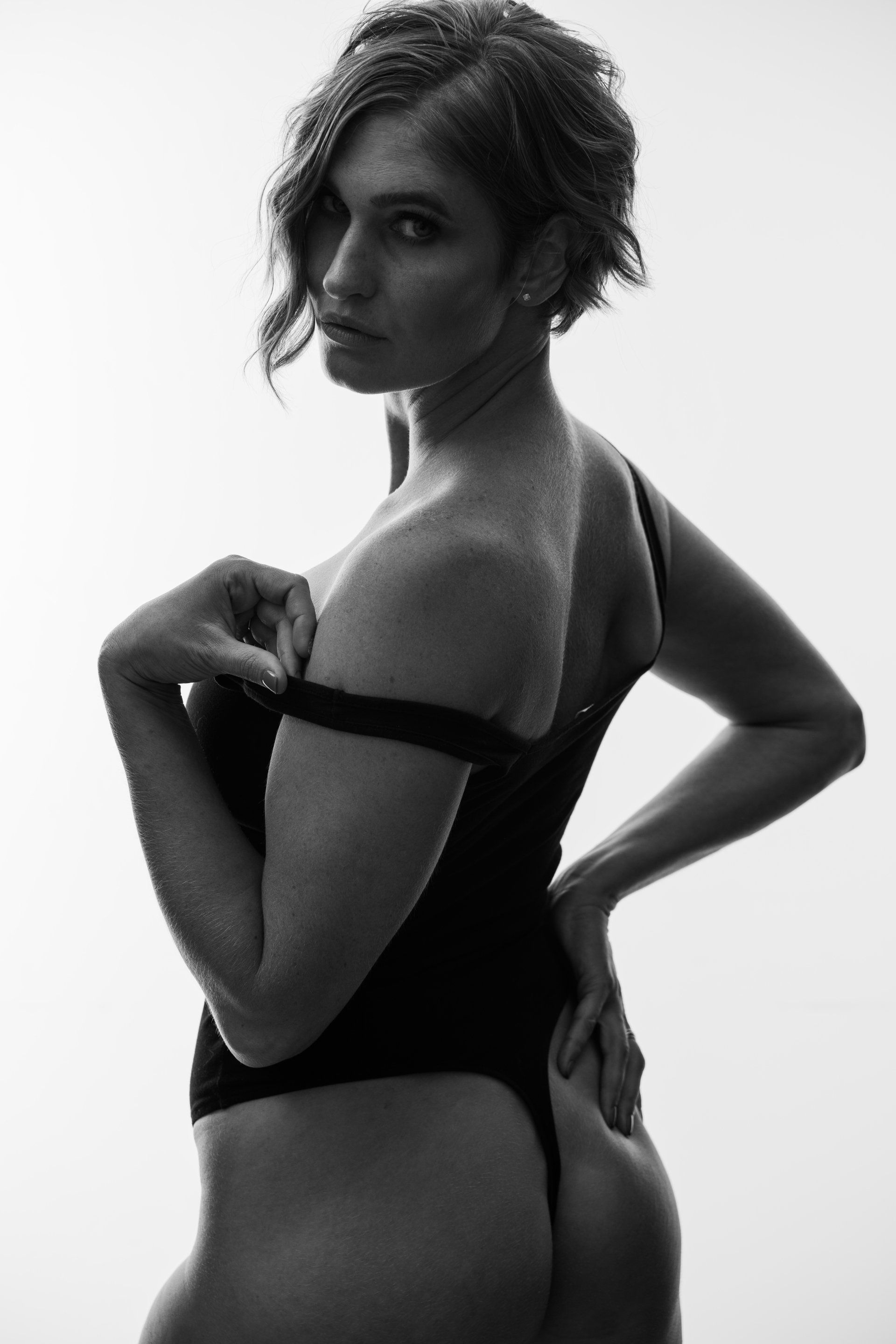 photo of a woman wearing black swimsuit 