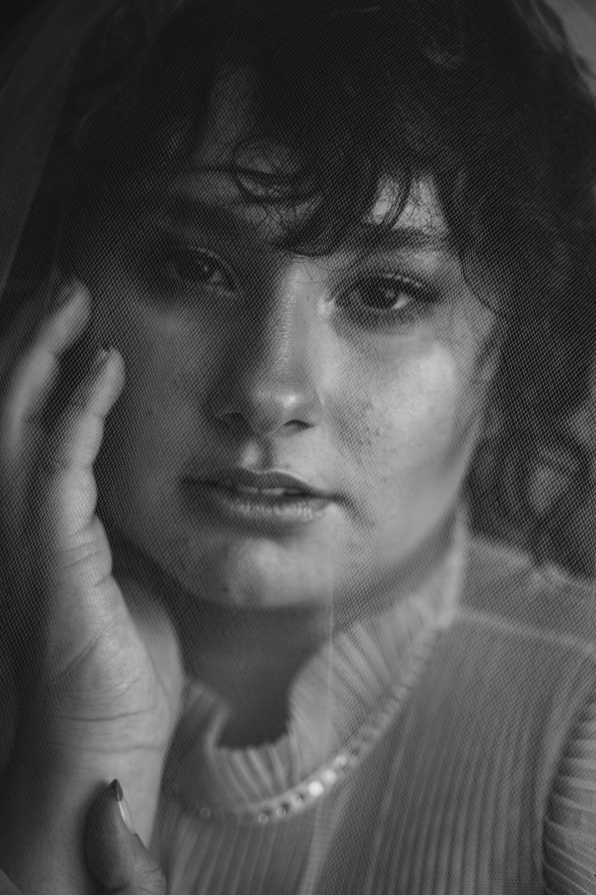 photo of a  curly woman in black and white 