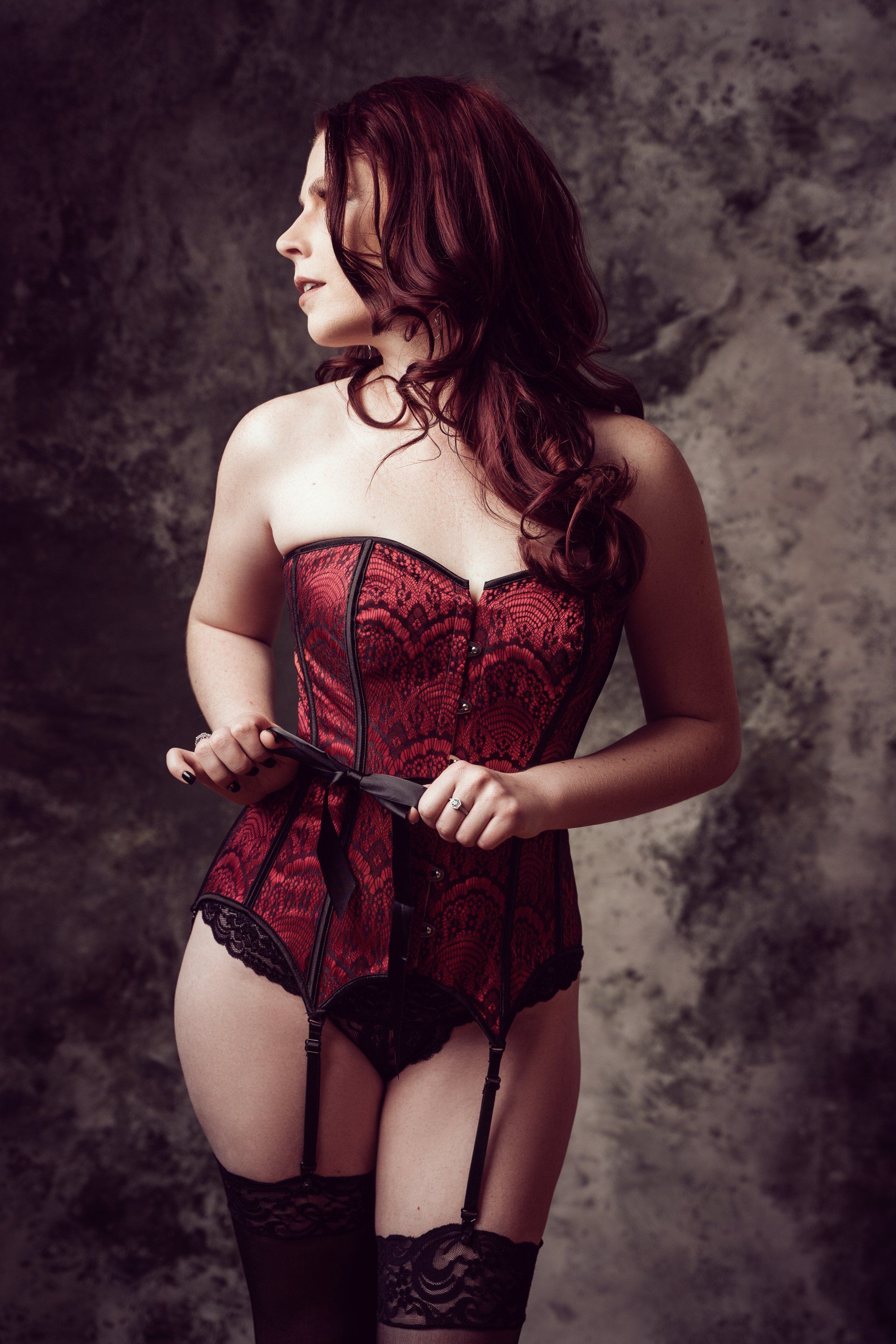 boudoir image of woman in red corset