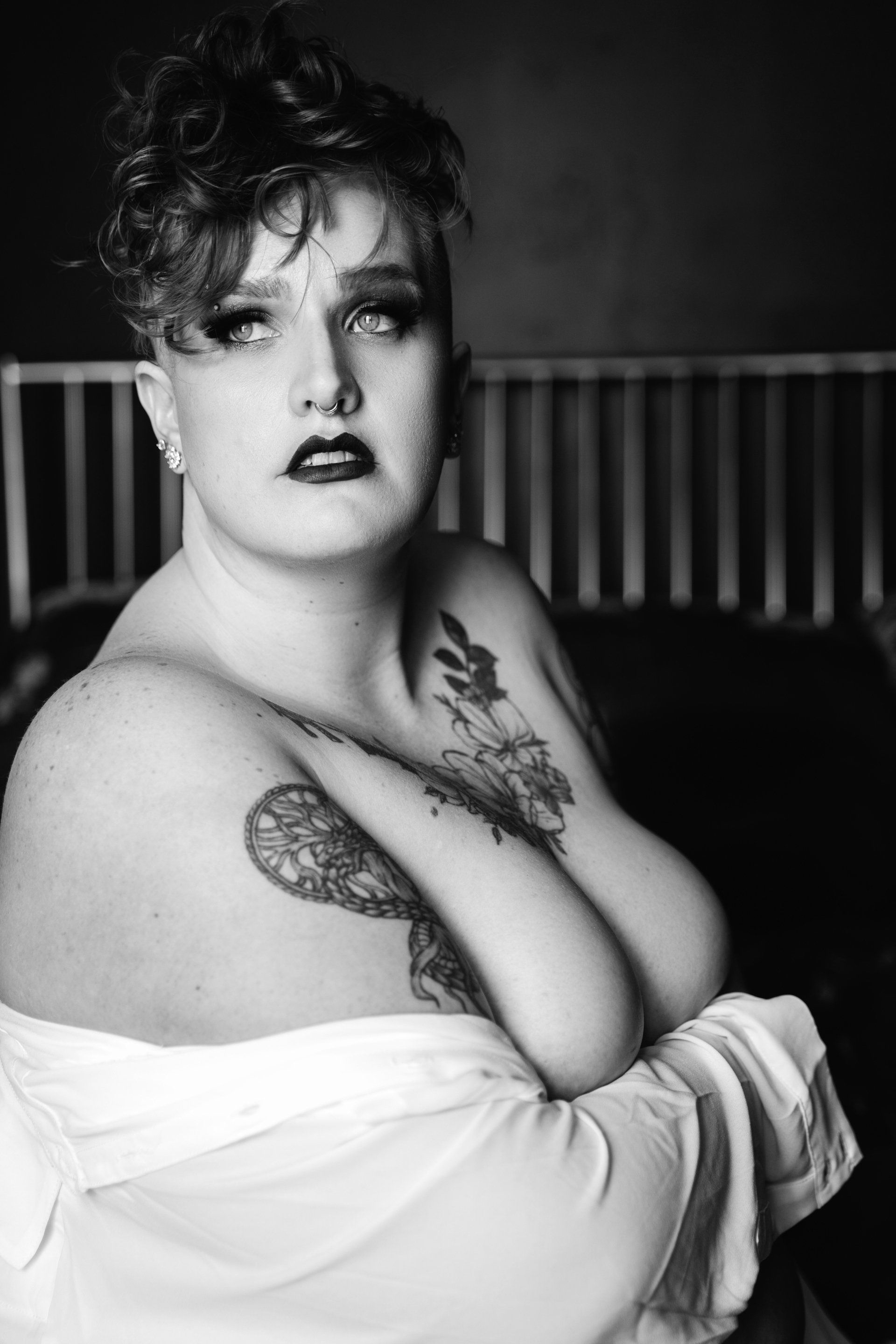nude woman looking longingly out window