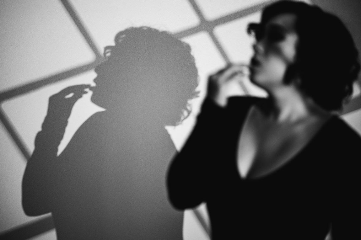 A woman with a shadow cast over her face.