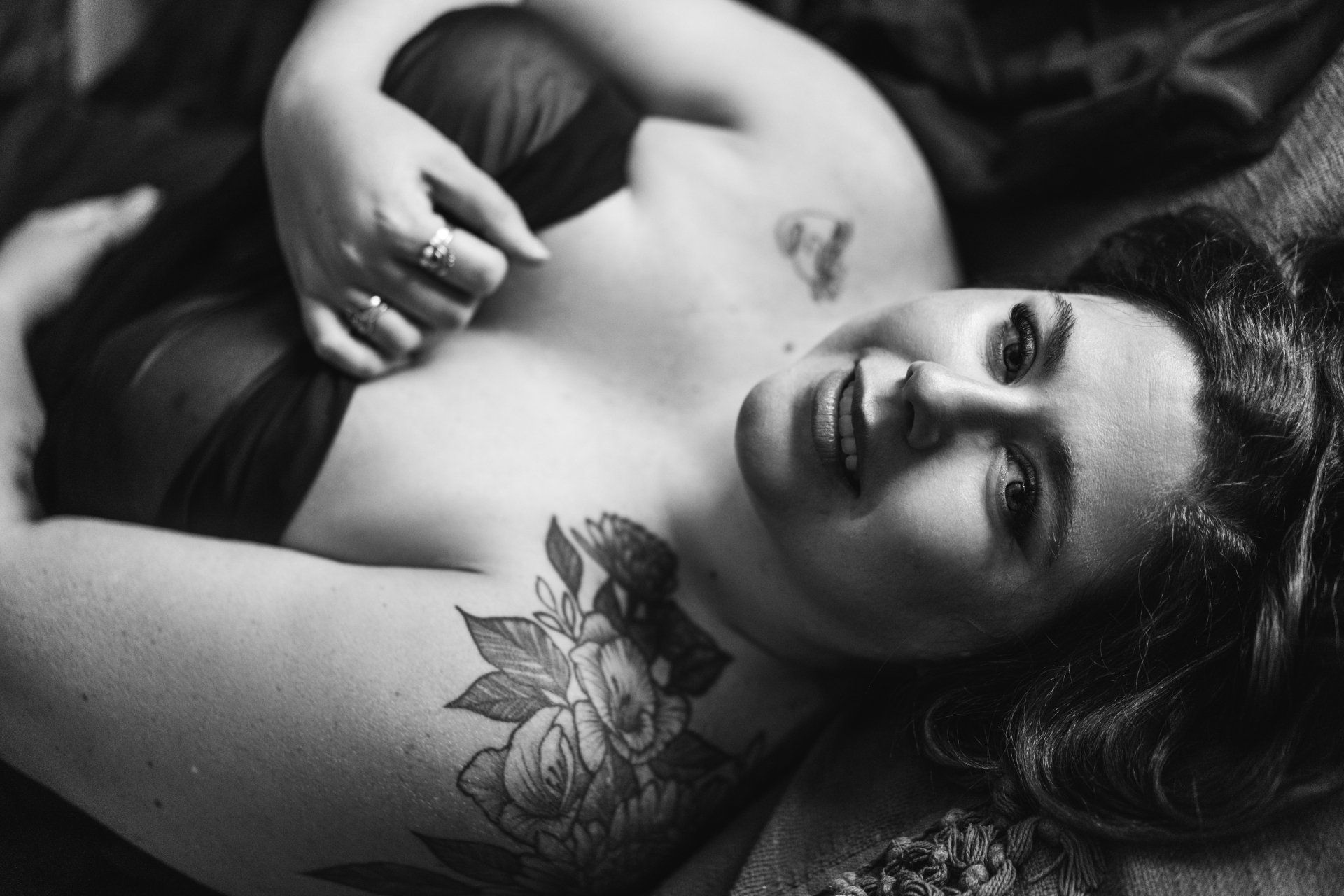 woman laying on the bed and smiling