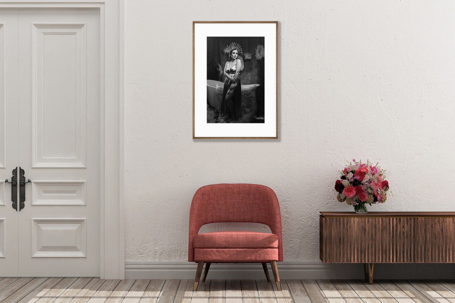 photo of a woman in a portrait with pink couch and pink boquet flowers