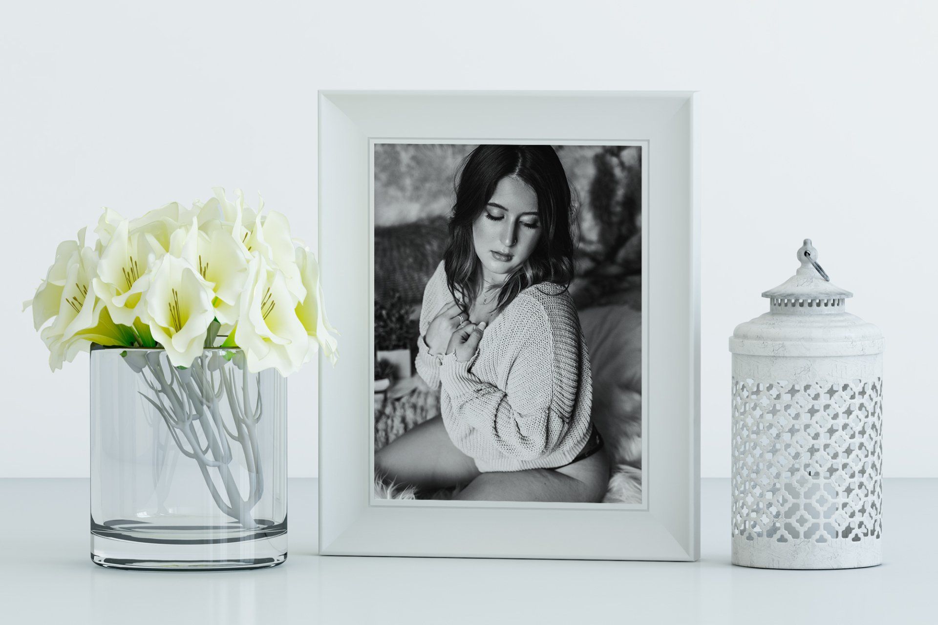 minimalist corner with white lampshade  and black and white of woman's photo