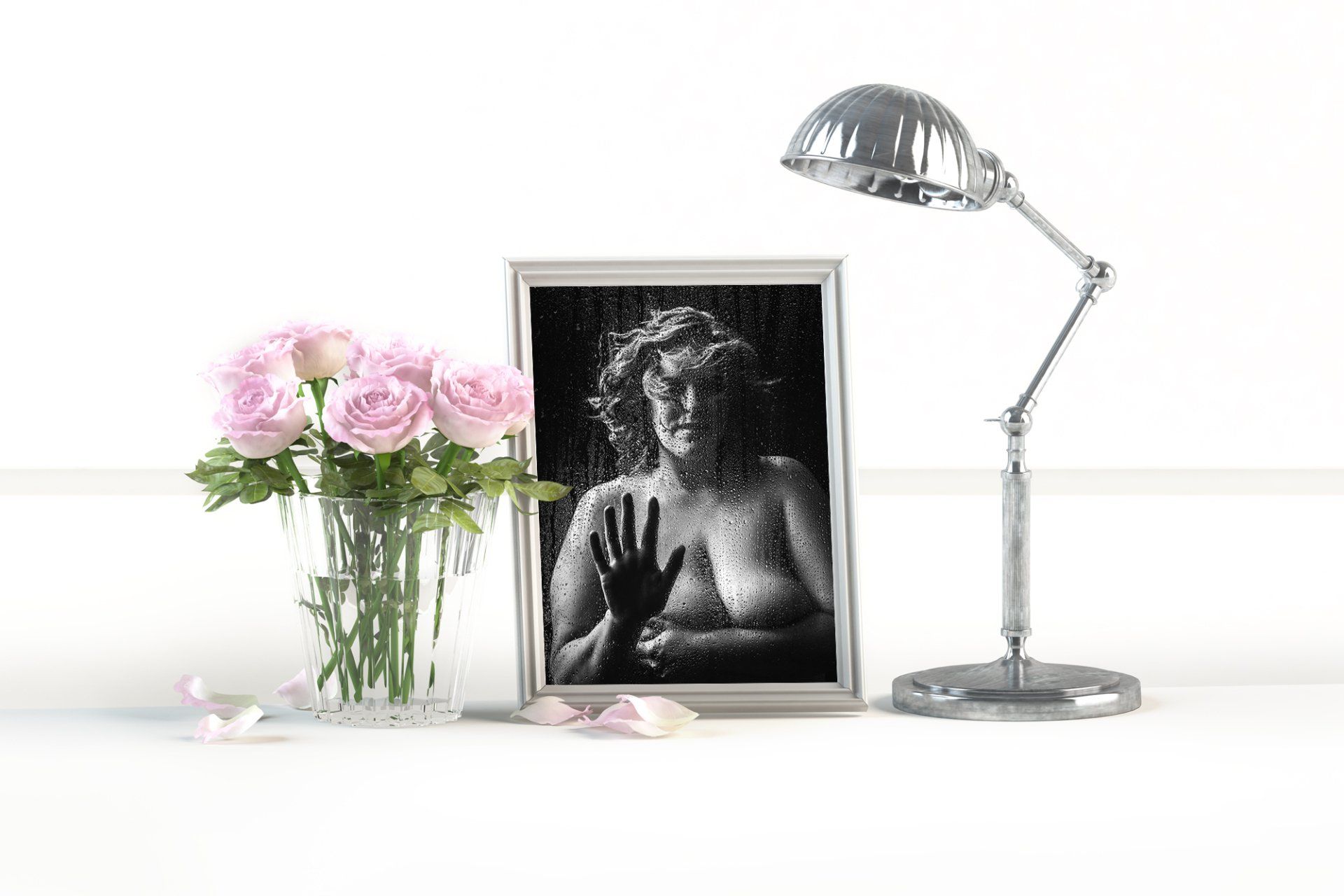 flower in pink color in a glass and portrait of woman in black n white color with lampshade
