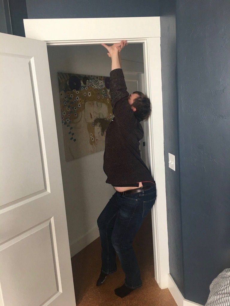 A man posing by the door.