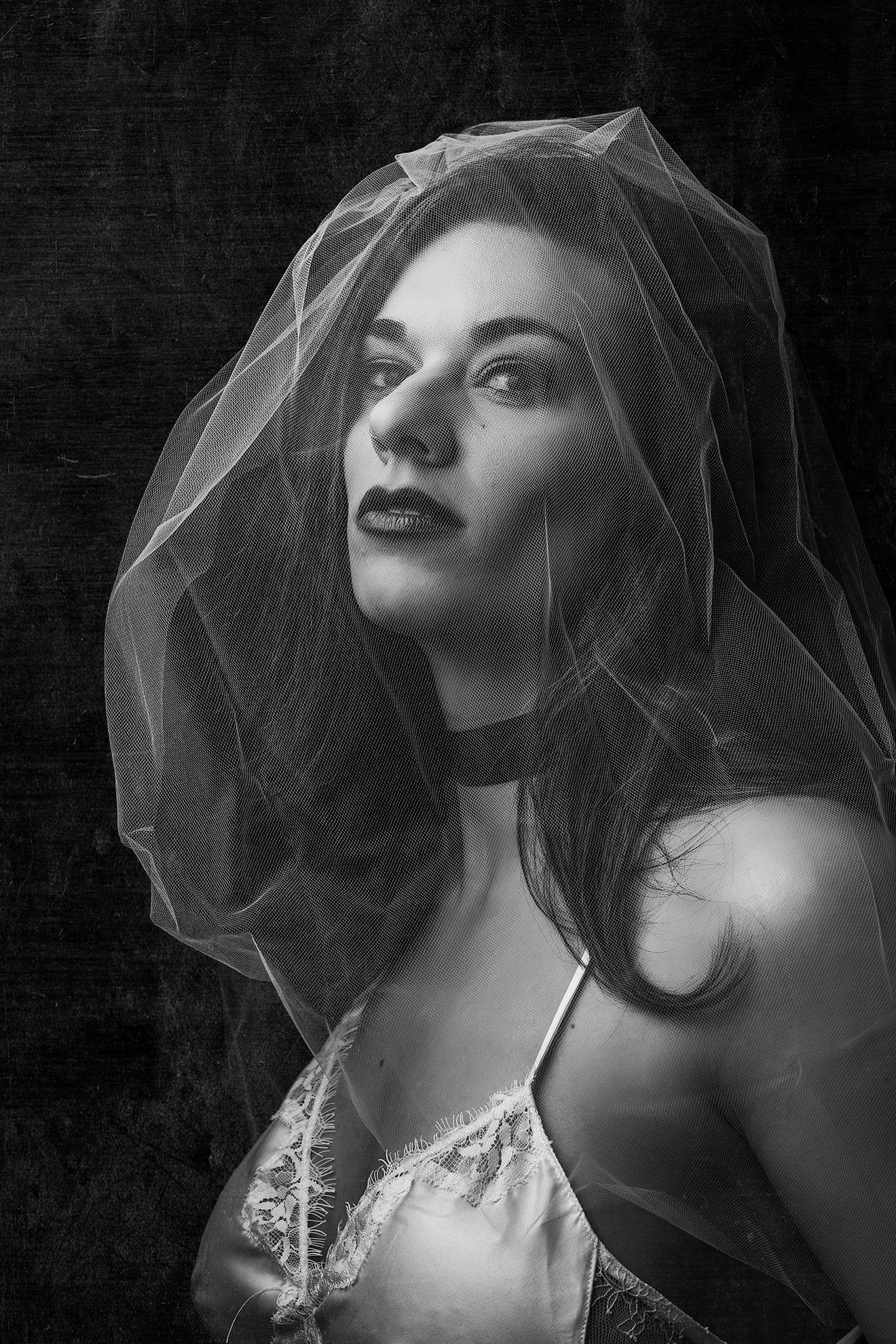 A woman with a veil for Bridal Boudoir.
