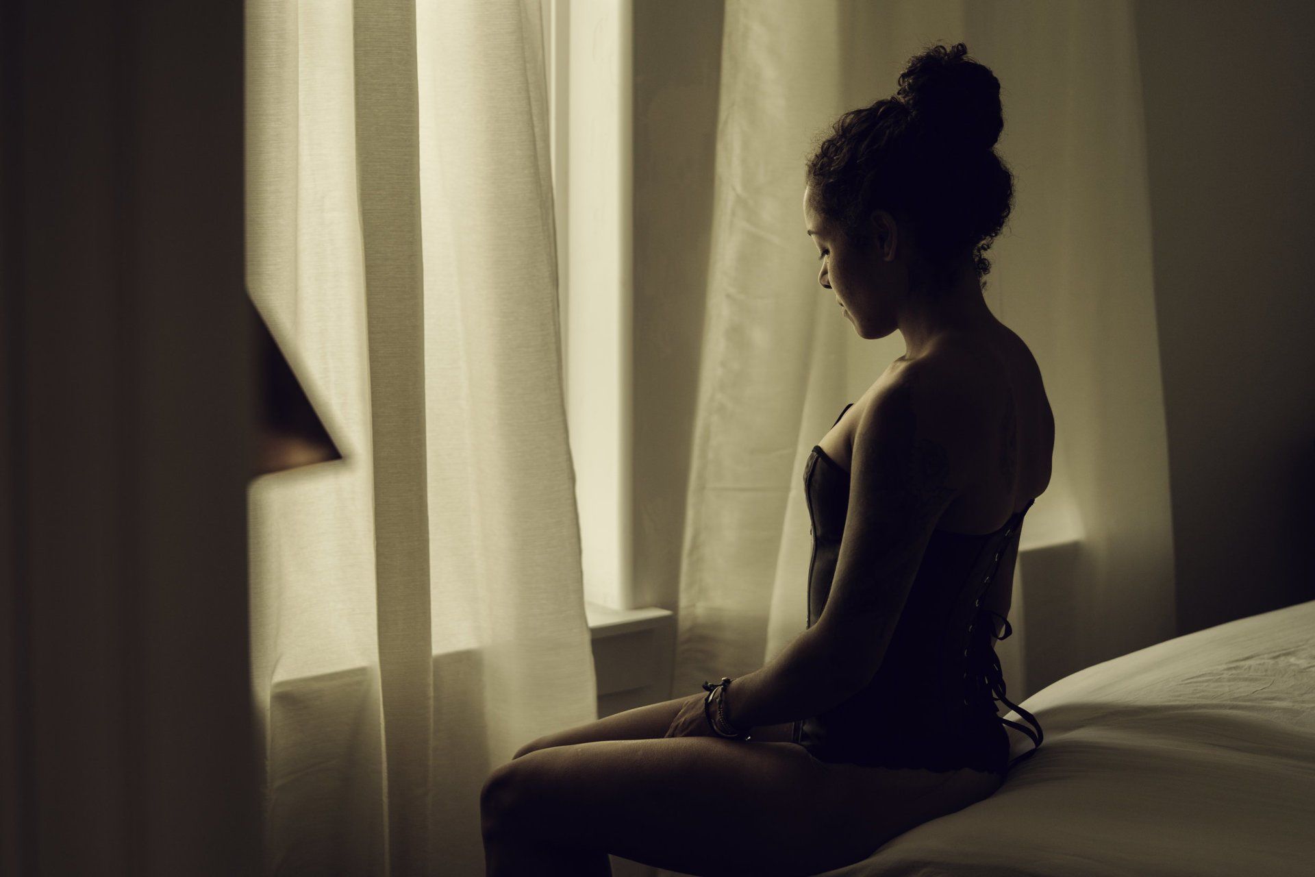 Utah Boudoir Photo woman sitting on bed