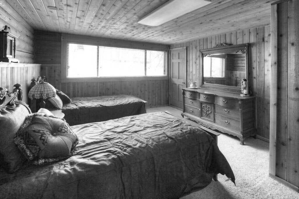 bedroom with two beds in a log cabin in Utah Sundance