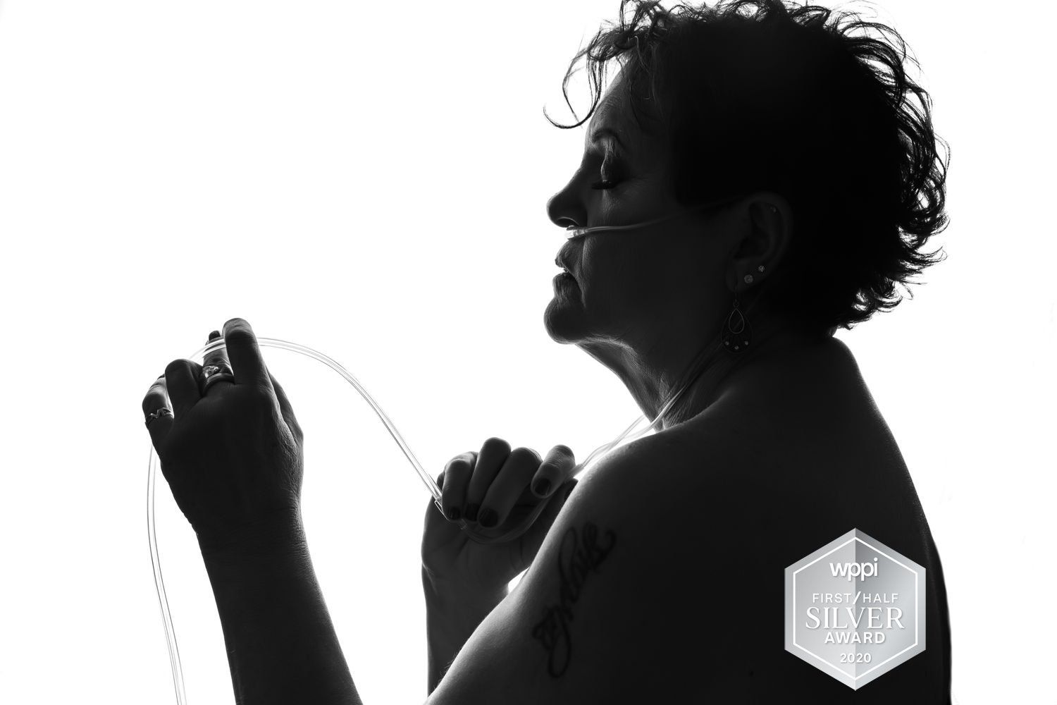 Ogden portrait studio black and white photograph of a woman with oxygen mask