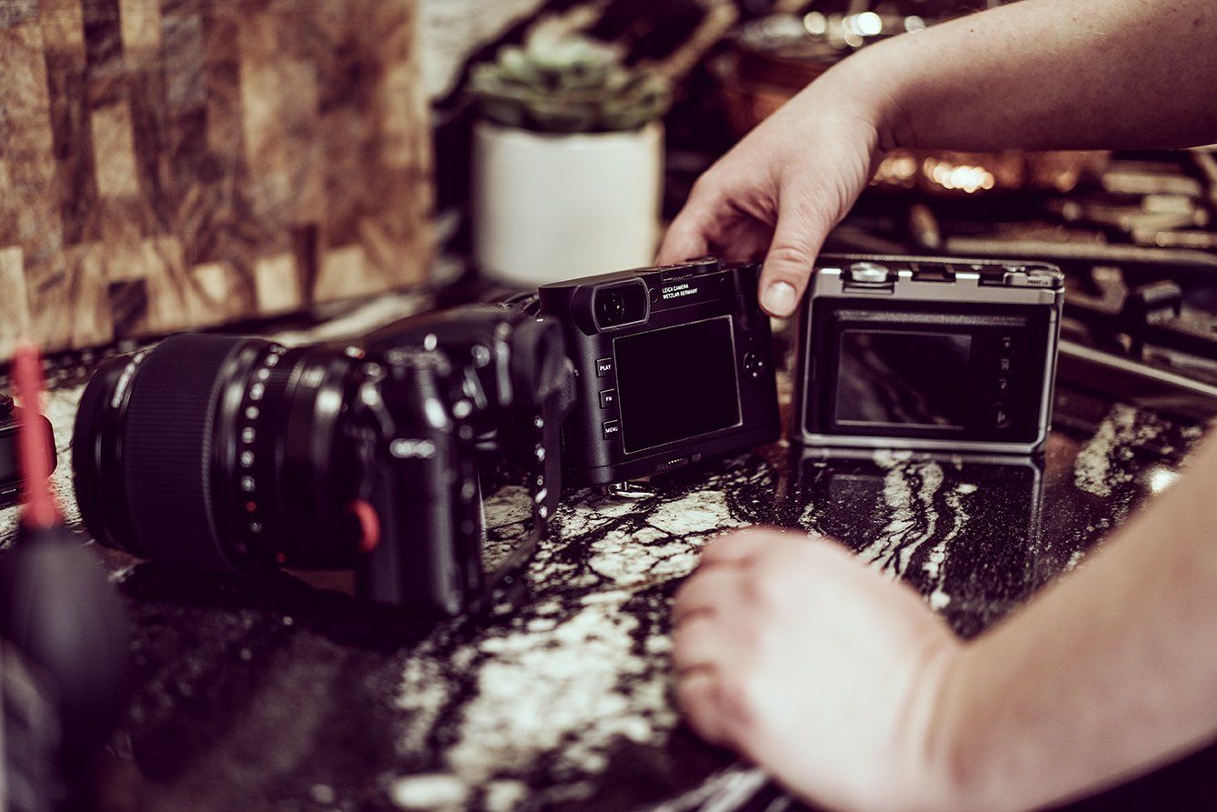 cameras sitting on a table
