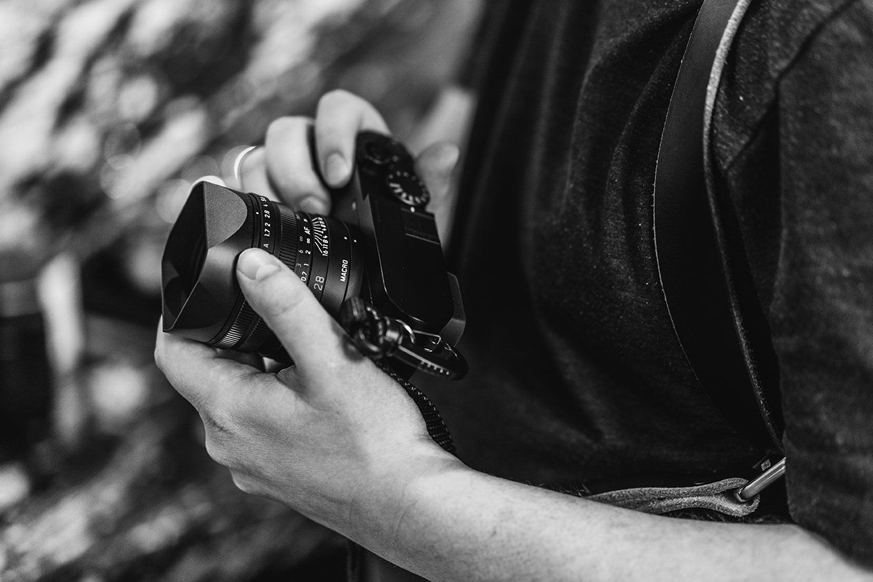 hands holding a camera