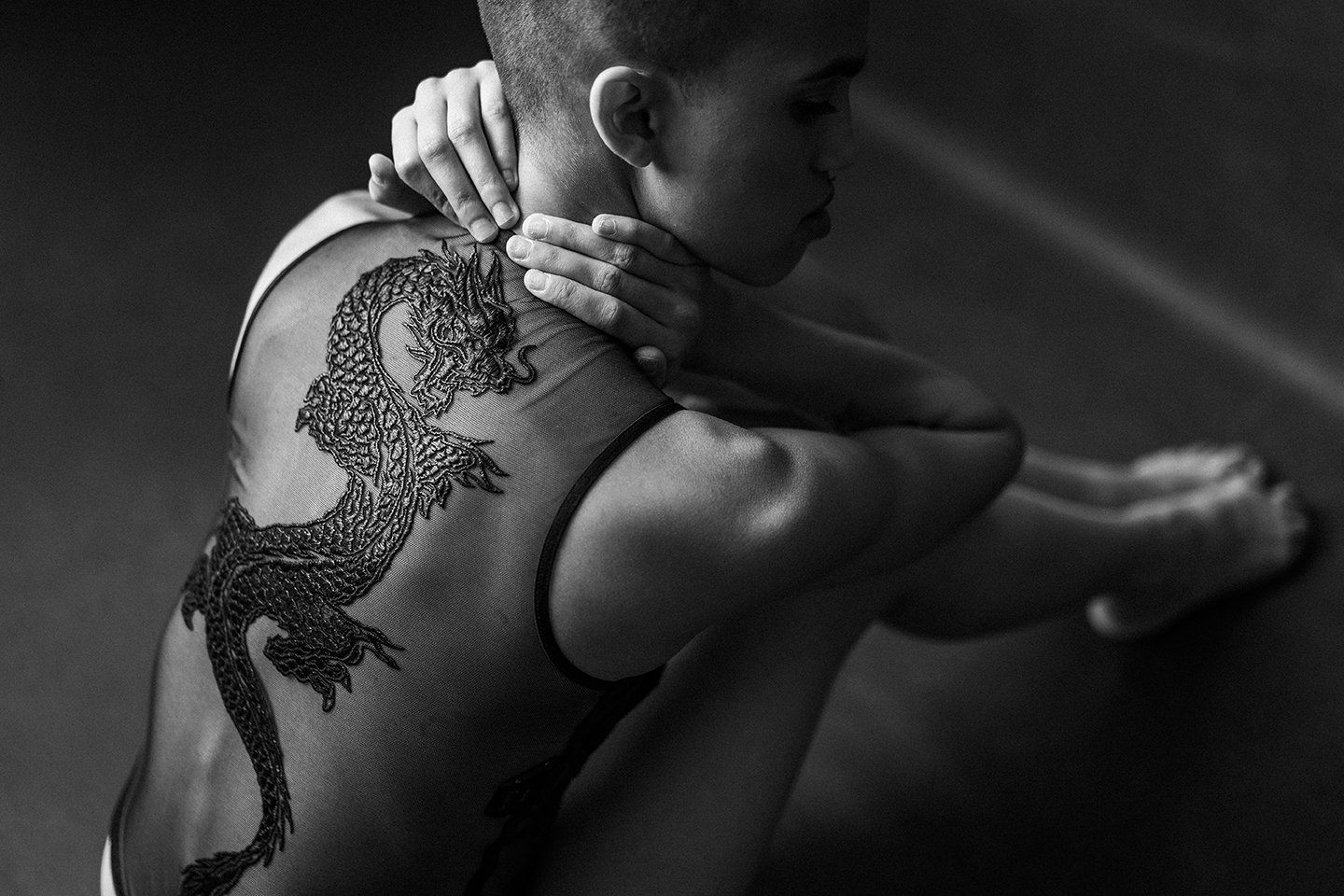Ogden photography woman sitting and touching her neck