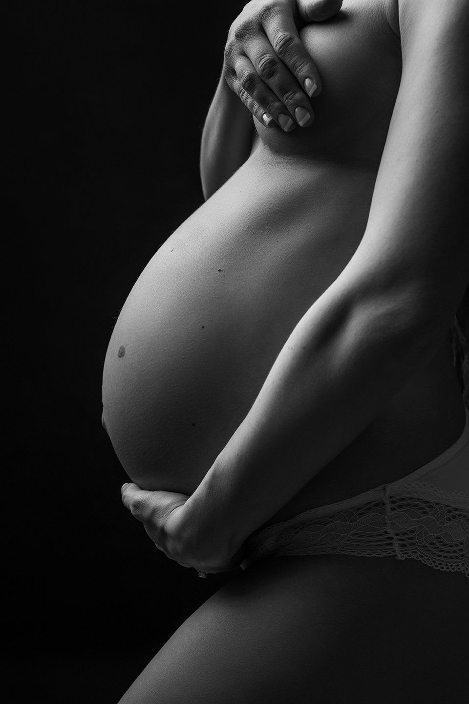 maternity black and white image of baby belly