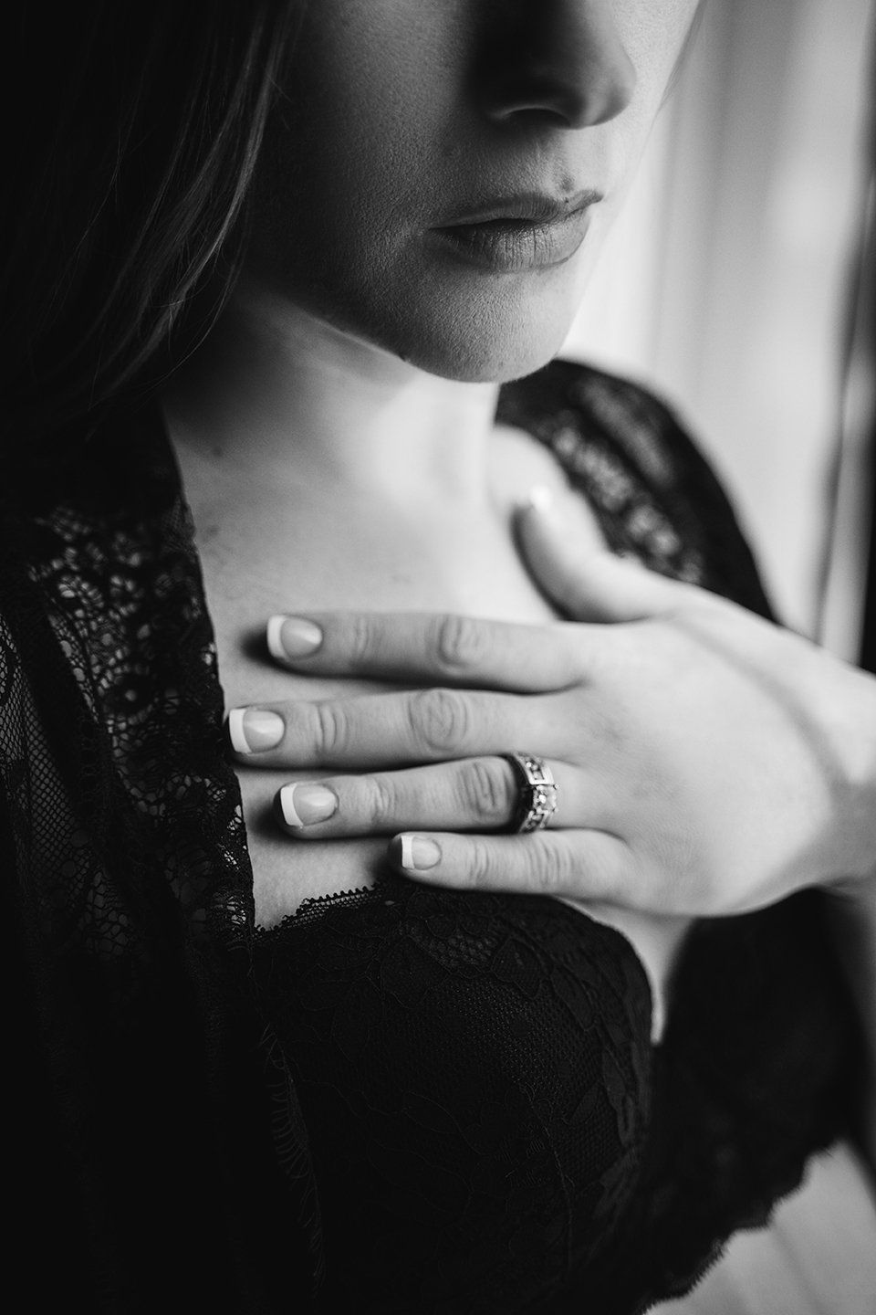 black and white portrait focused on wedding ring