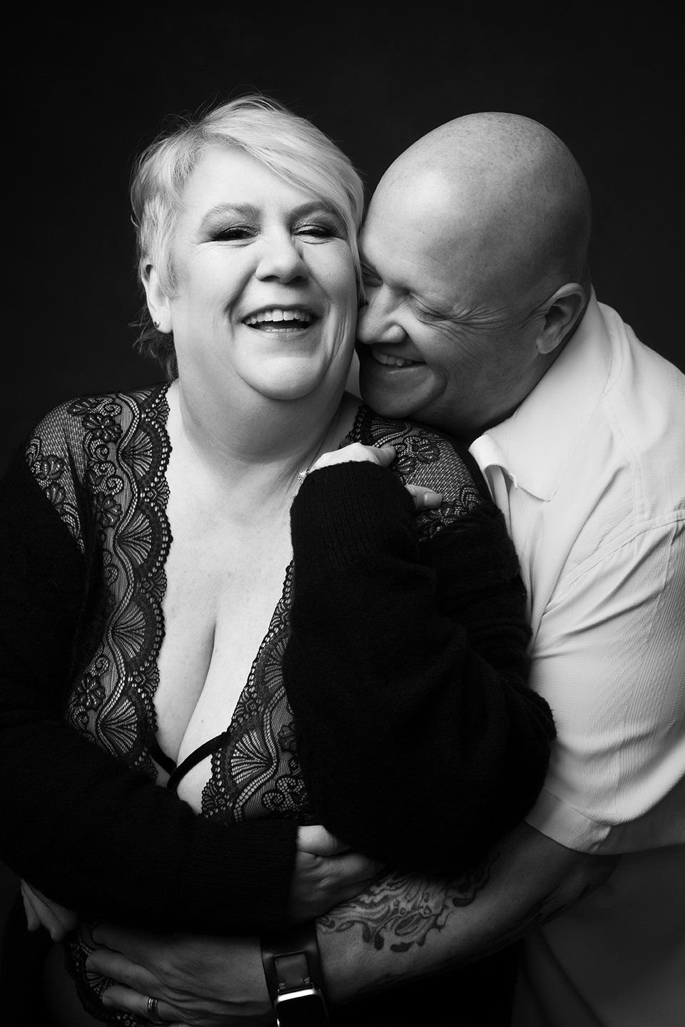 couples boudoir, image of a smiling couple