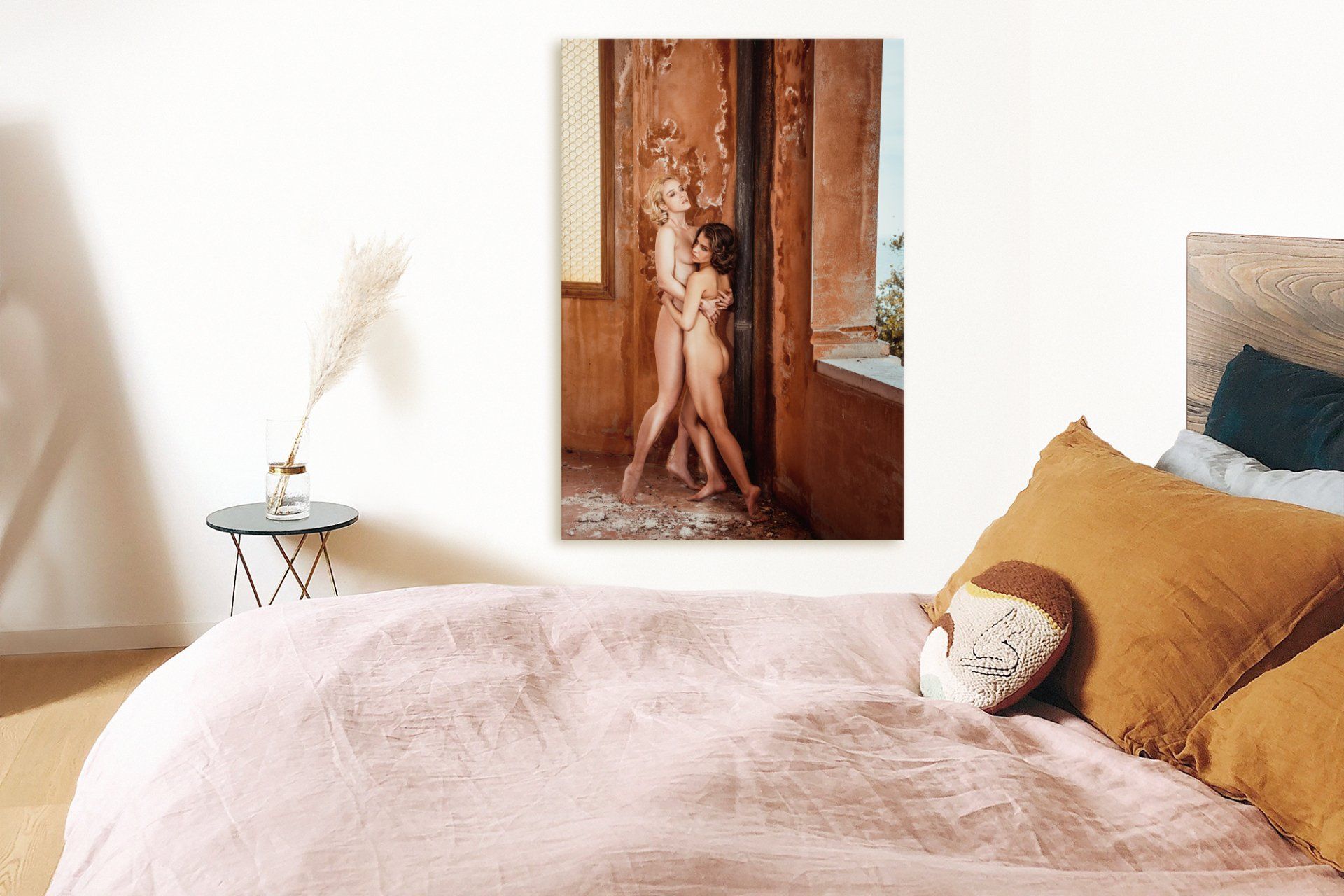portrait of 2 woman without wearing any dress and  bed in color pink and pillow in color brown