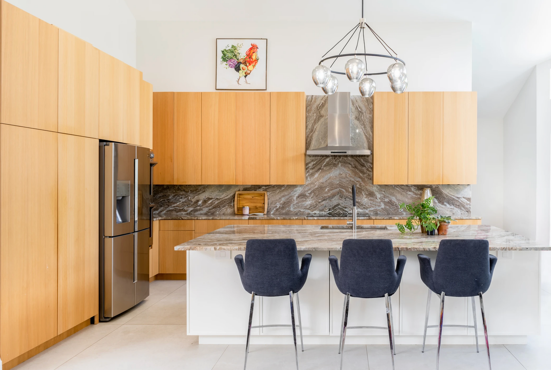 A kitchen with stainless steel appliances and wooden cabinets