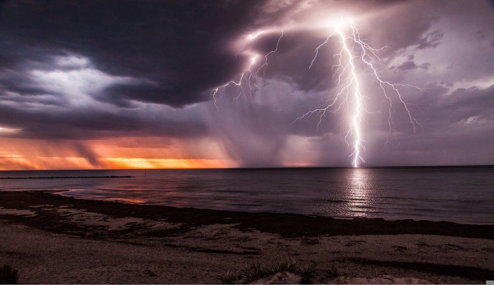 Lightning in A Storm Over the Ocean — Moving Beyond OK In Mount Warren Park, QLD