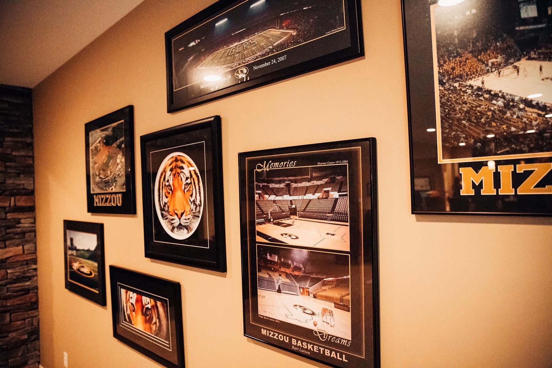 Sports Memorabilia Hung on a Wall. Sell Your Collection at Auction With Atterberry in Mid-Missouri.