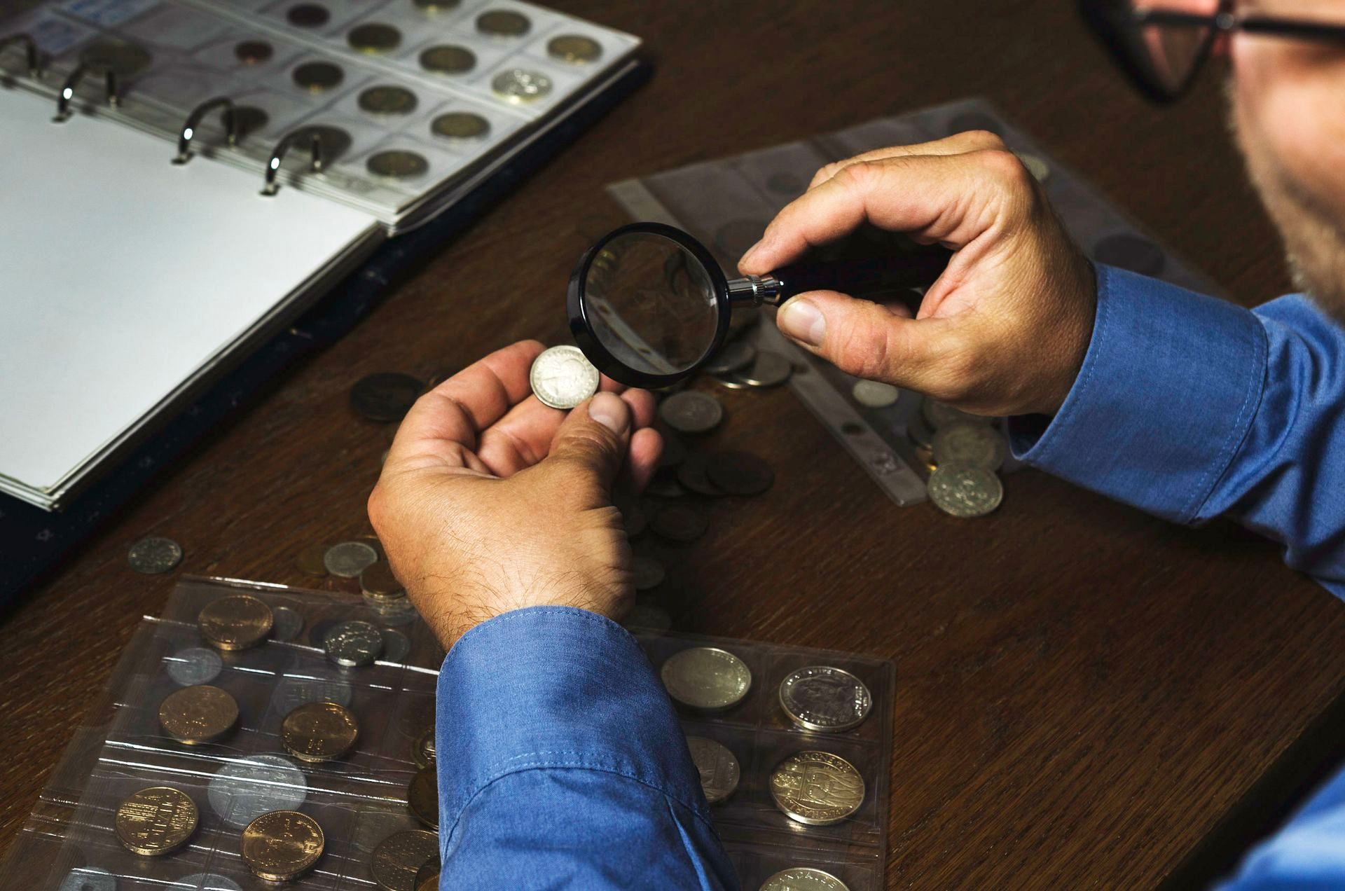 A Coin Specialist Inspects a Rare Coin. Atterberry Sells High-Quality Coins & Paper Money.