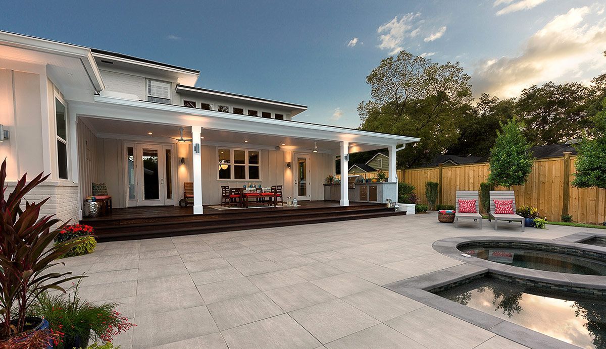 Spacious concrete patio with covered seating area and fire pit, worked on by Elite Form Concrete in Eagle Mountain, UT.