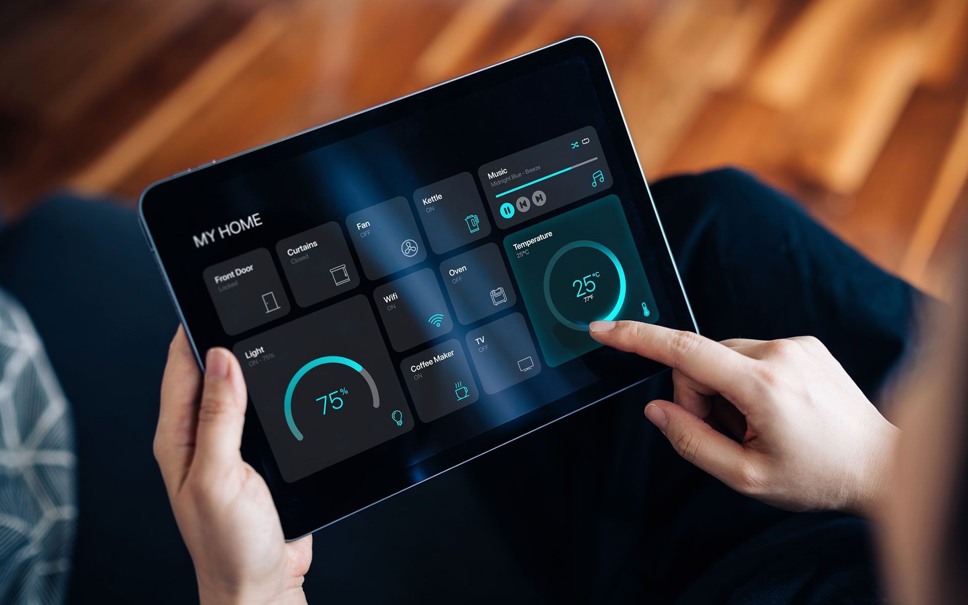 A person is holding a tablet with a calculator on it.