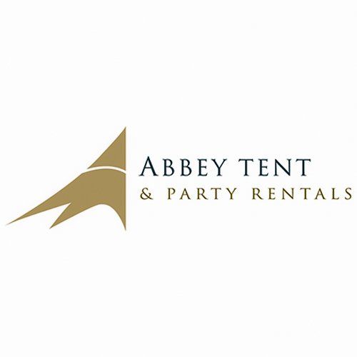 A logo for abbey tent and party rentals with a gold triangle on a white background.