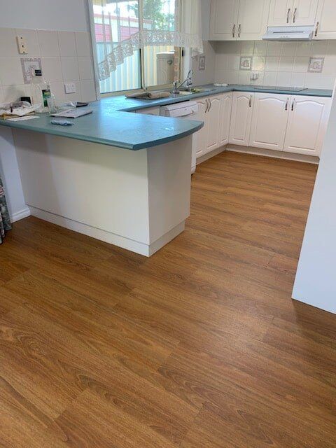 Timber floor in kitchen — Flooring Direct Mid North Coast in South Kempsey, NSW