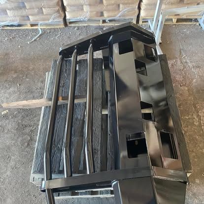 Modern office with white desks, black chairs, and computers