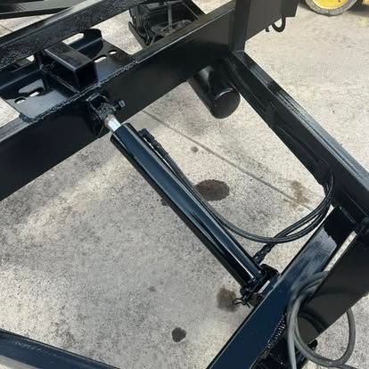 A cozy window nook with neutral pillows and a knitted blanket