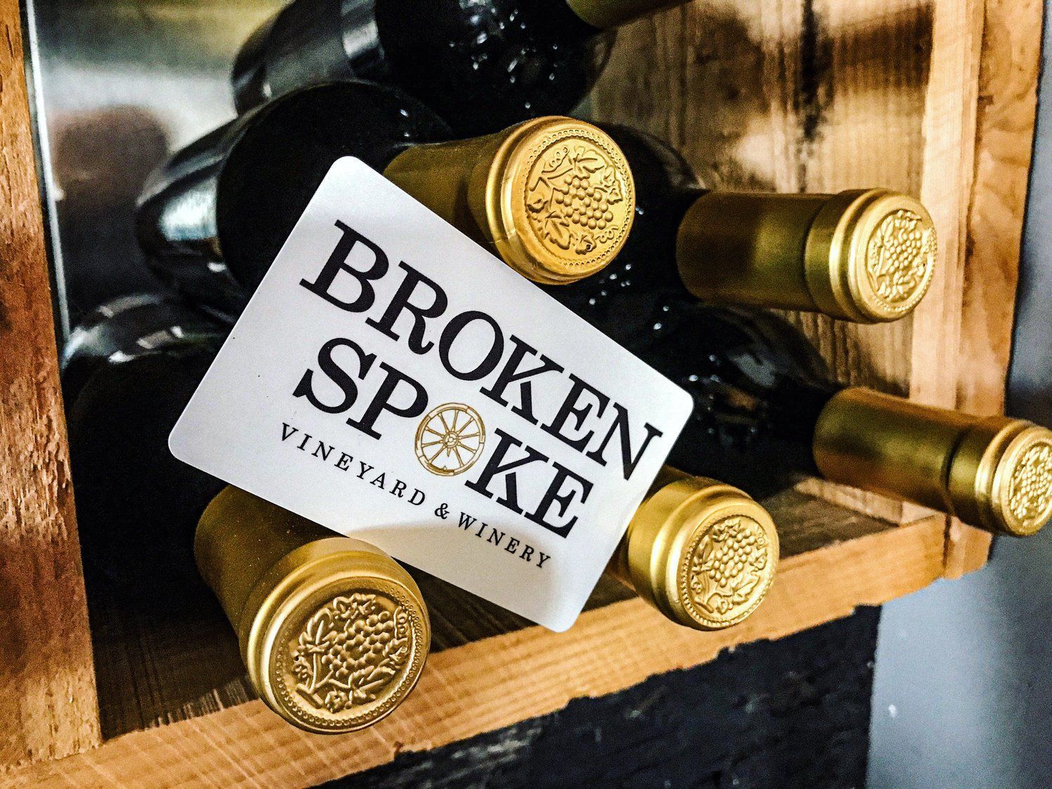 Broken spoke vineyards and winery wine bottles stacked on top of each other