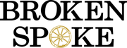 A logo for broken spoke with a wheel in the middle.