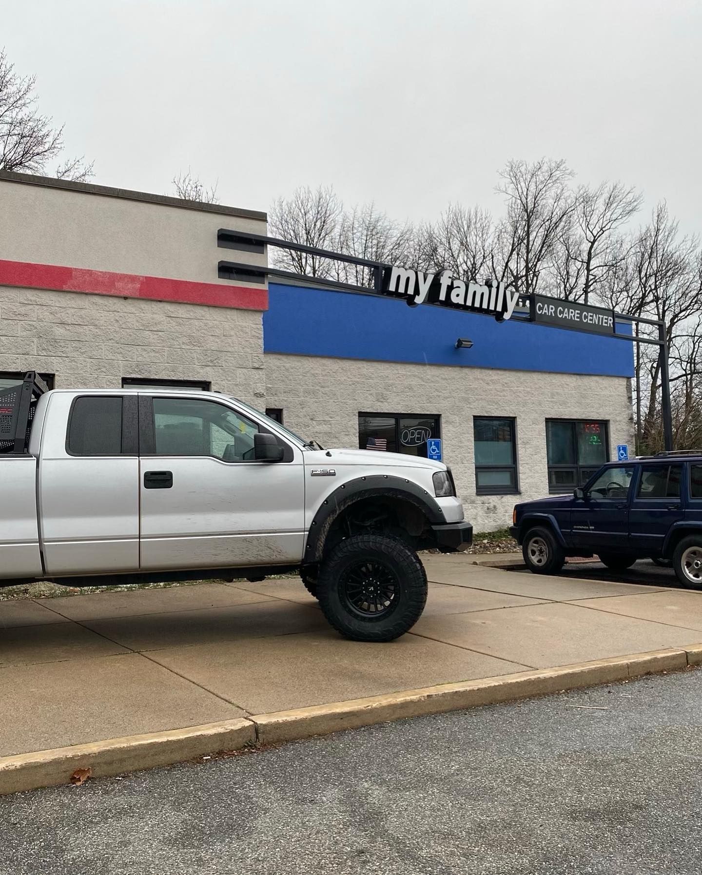 Pickup Truck Parked Outside Auto Repair Shop Building | My Family Car Care Center