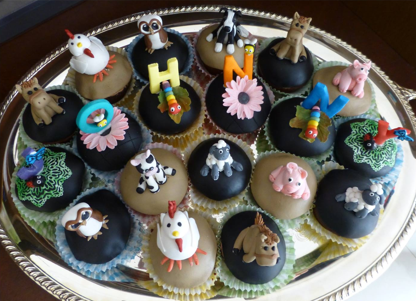 Cupcakes with cute 3d farm animal toppers