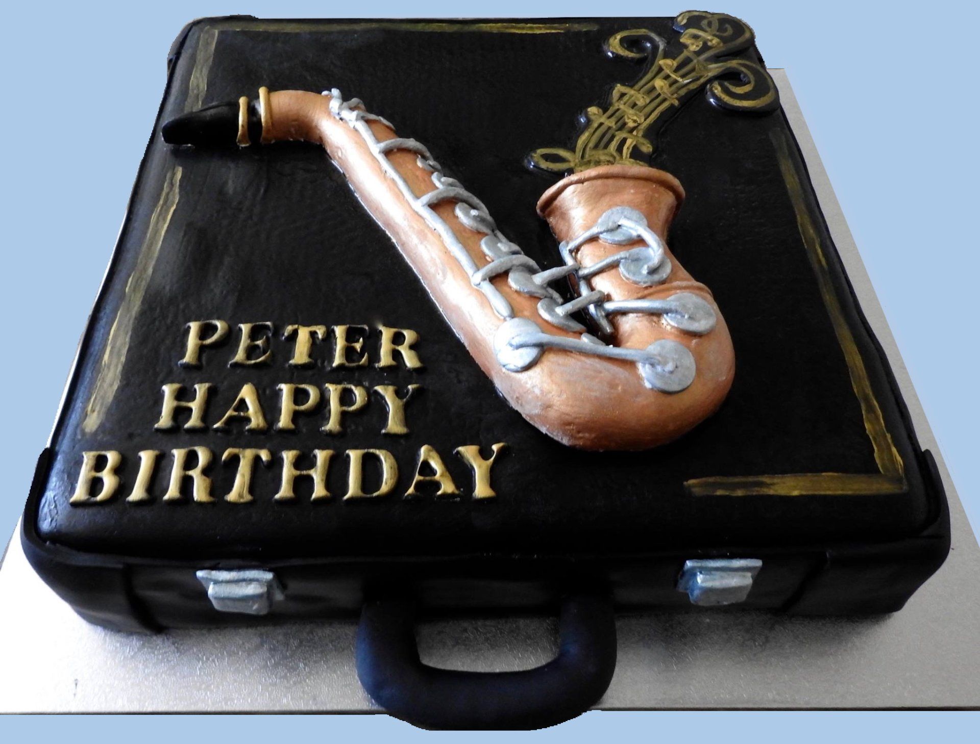 Birthday Cake Black square music case with saxophone.