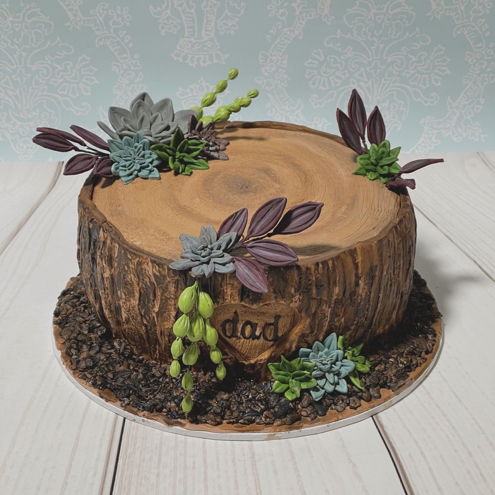 Birthday Cake done up as a tree stump with sugar succulents.
