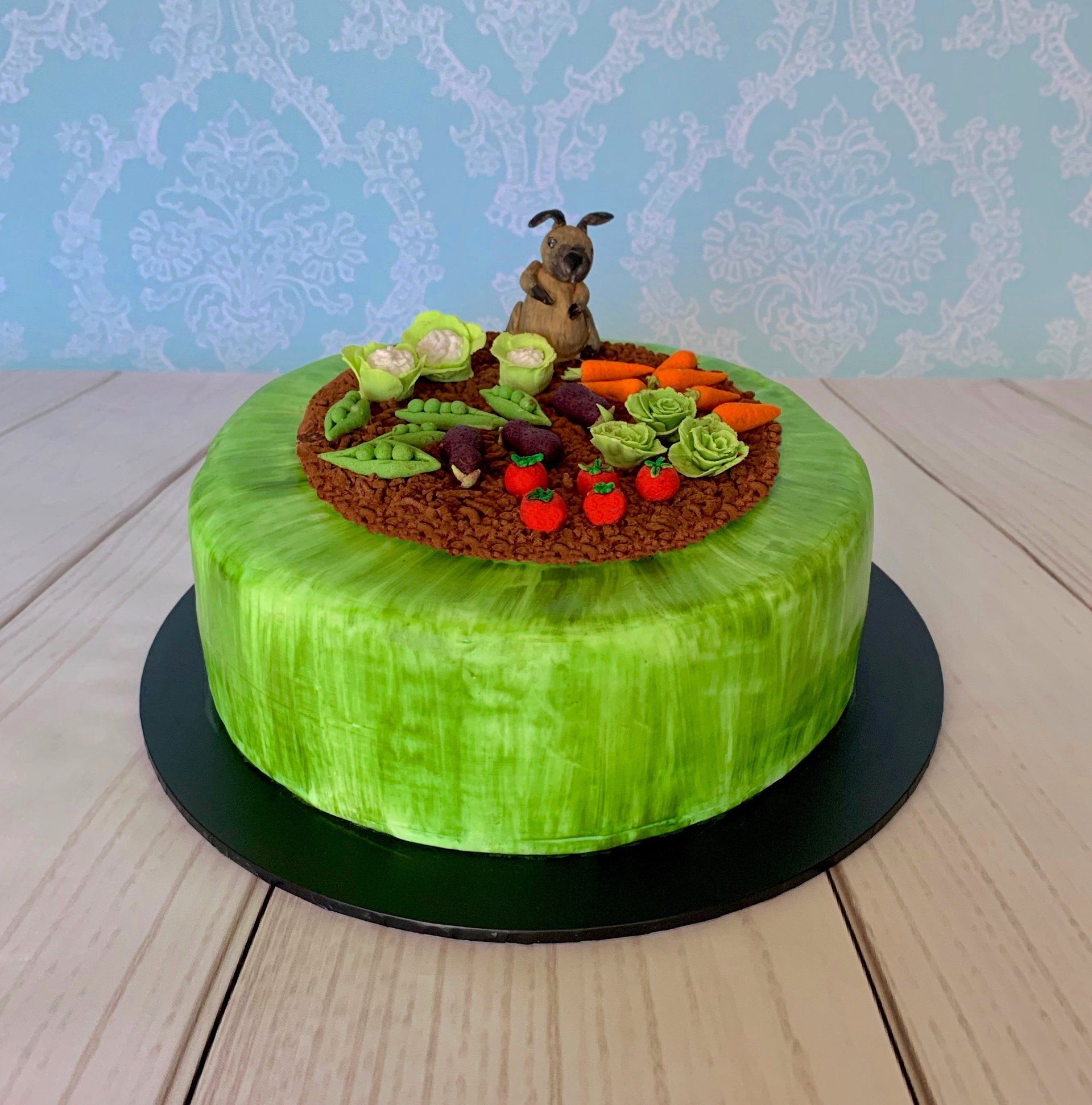 Garden Themed Cake With Hand A Sculpted Veggie Patch, A Cute Little Bunny Rabbit And Hand Painted Grass.