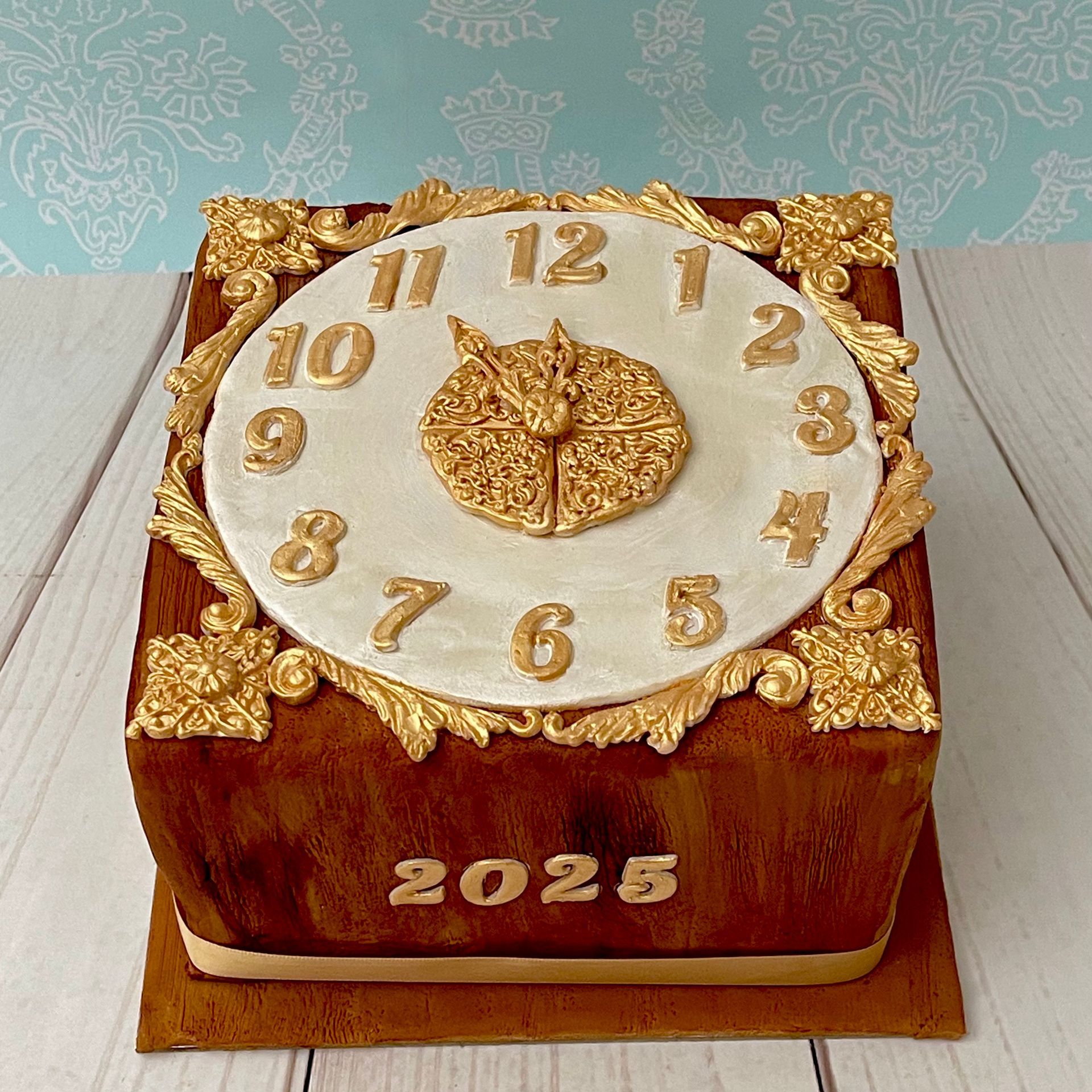 New Year's Cake, Covered in Wood grain textured fondant  and decorated to look like an ornate clock counting down to the new year. 
