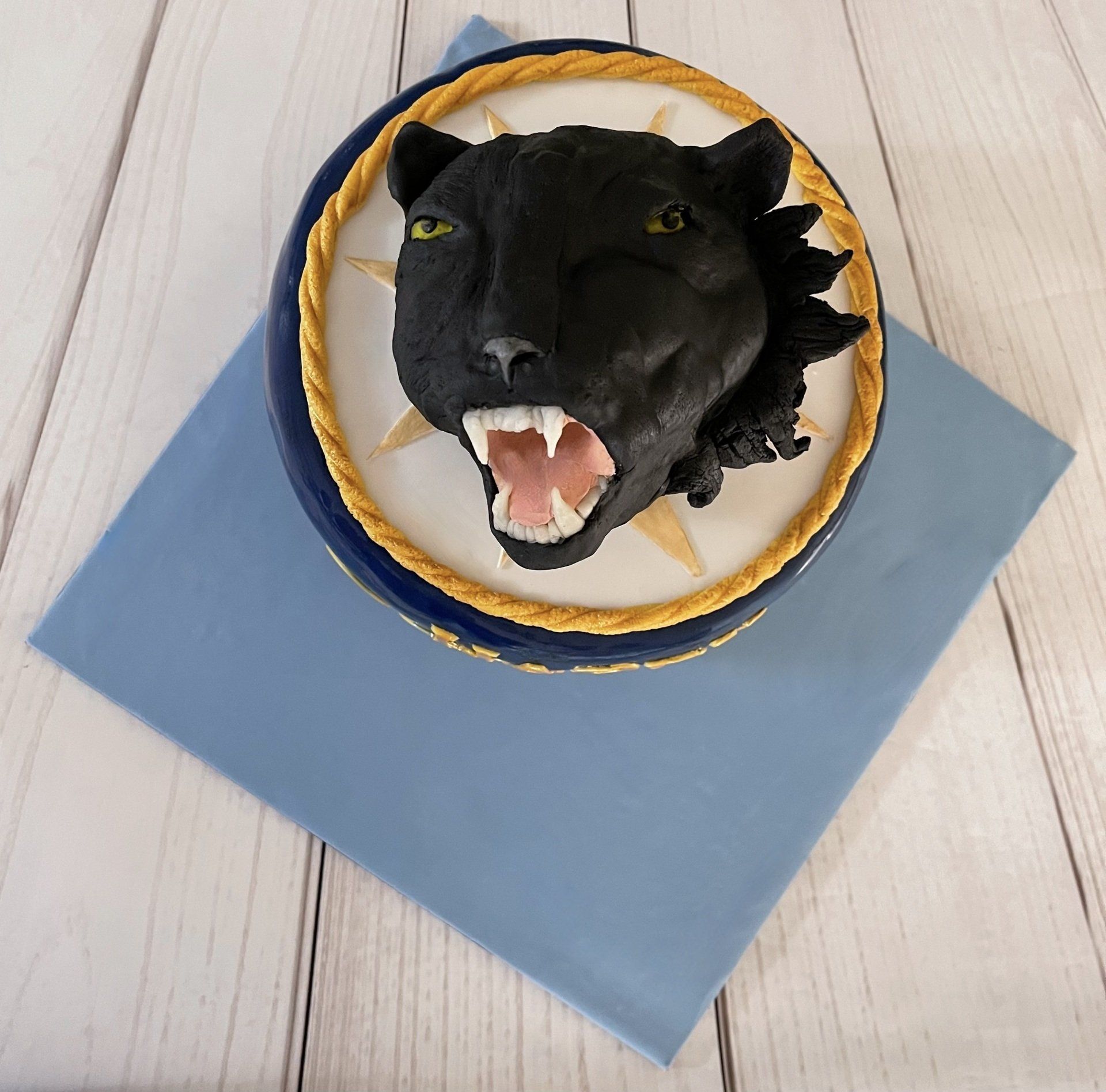 90th Birthday Cake.  Covered in Navy Fondant With a hand sculpted Panther based on the Gentleman's Royal Australian Air Force Badge