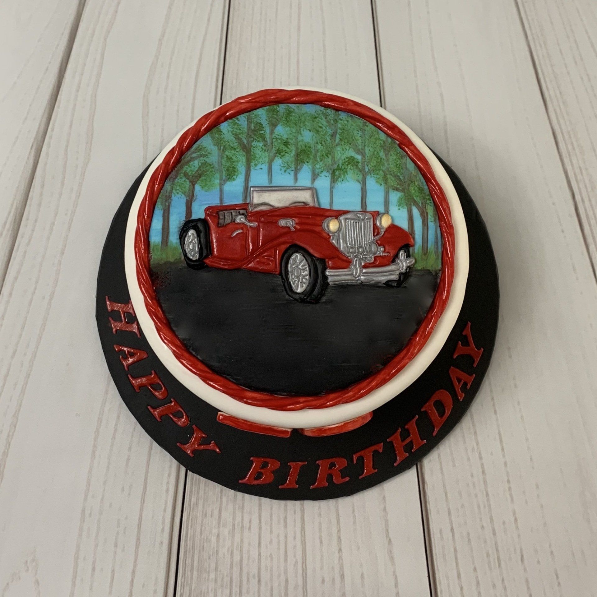 70th Birthday Cake with a hand embossed and hand painted fondant classic car. Top View