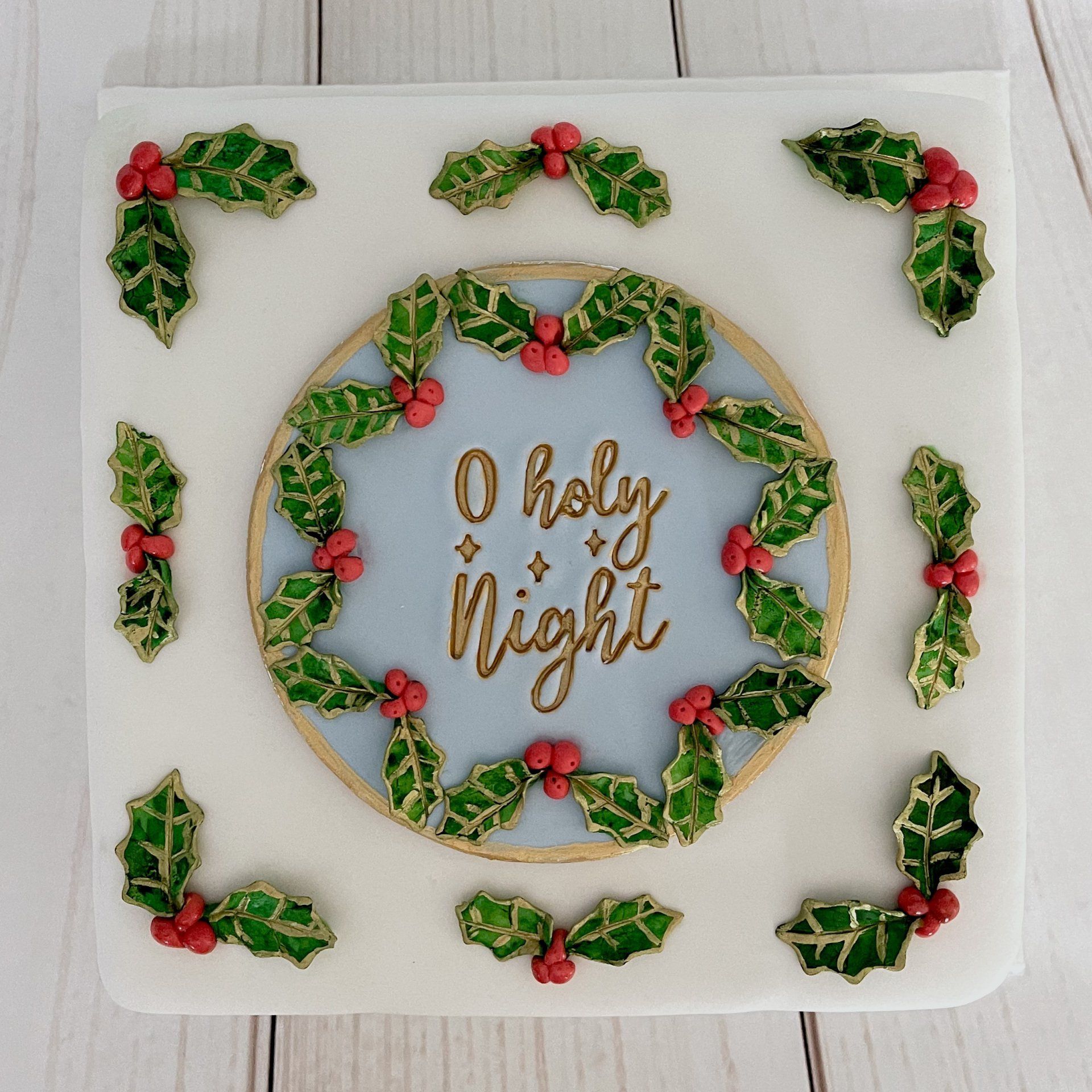 Christmas cake with Fondant Holly and the words O Holy Night