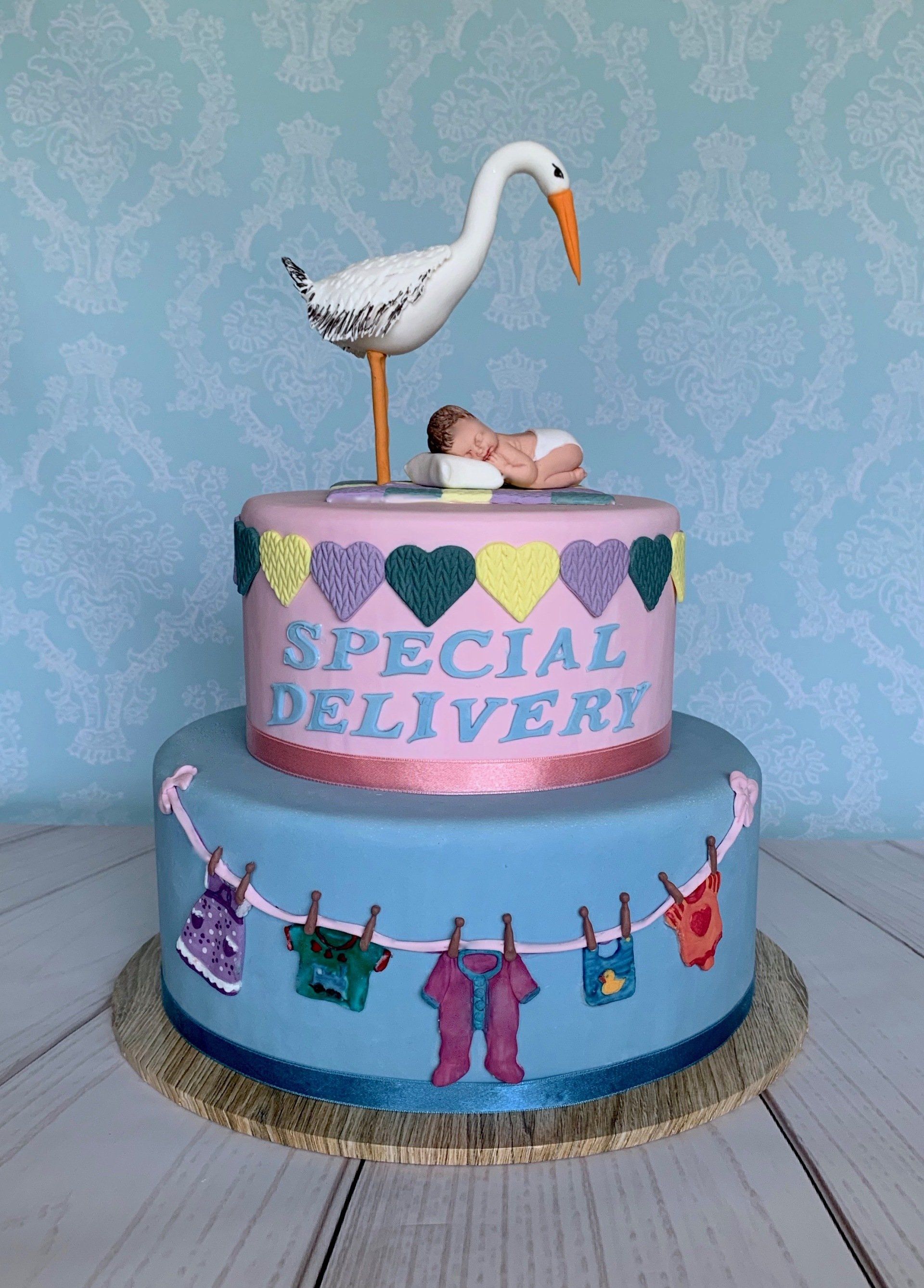 2 tier Baby Cake. Cute Stork with baby,  baby clothes, special delivery.