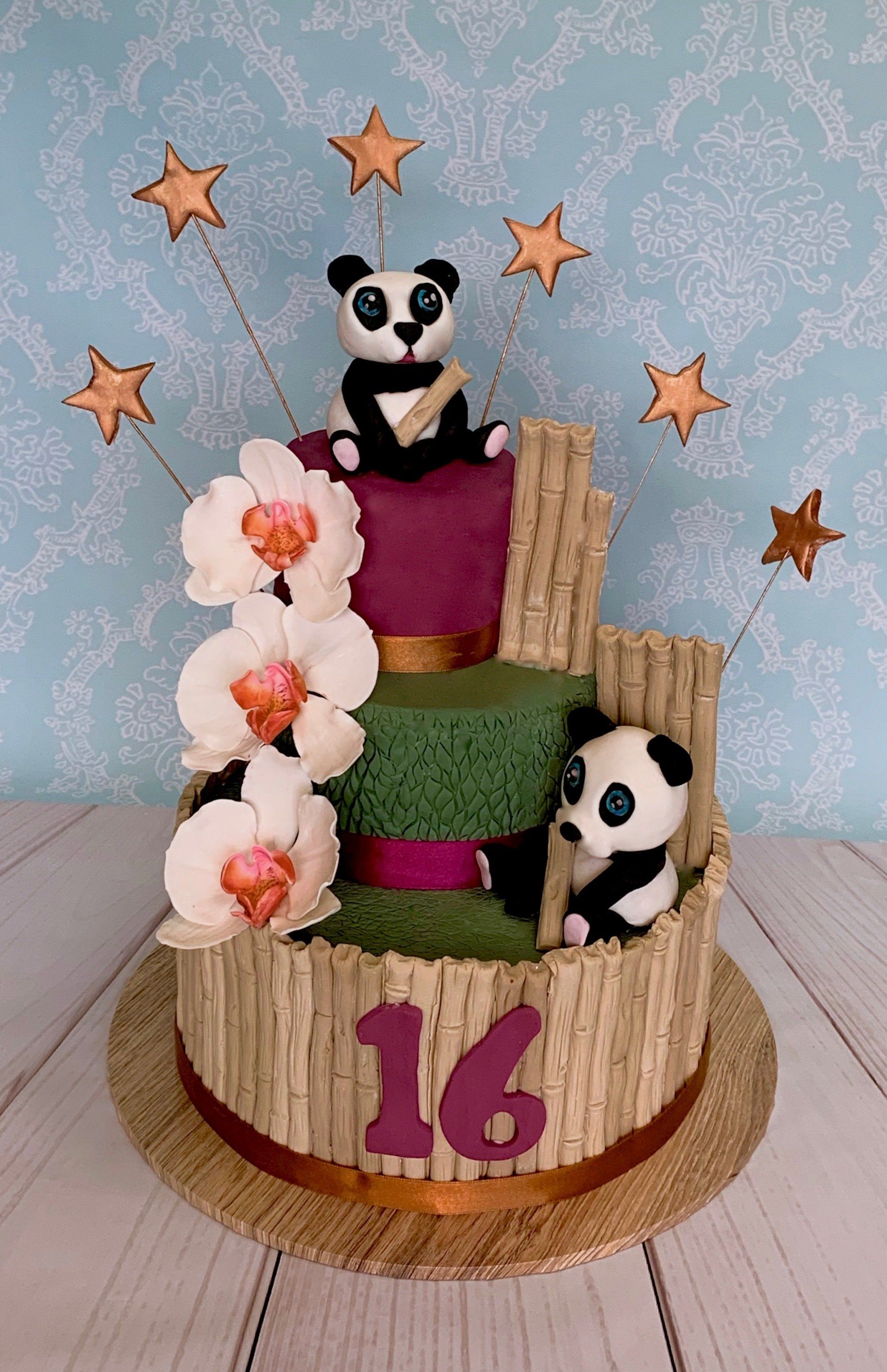 3 tier girls 16th birthday cake with Pandas, orchids and bamboo.