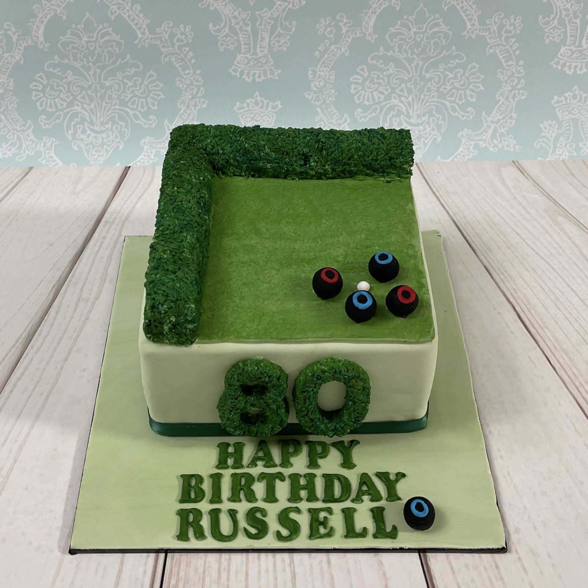 80th Birthday cake, with soft green fondant, Fondant Hedge, Fondant Lawn, Fondant lawn bowling balls.
