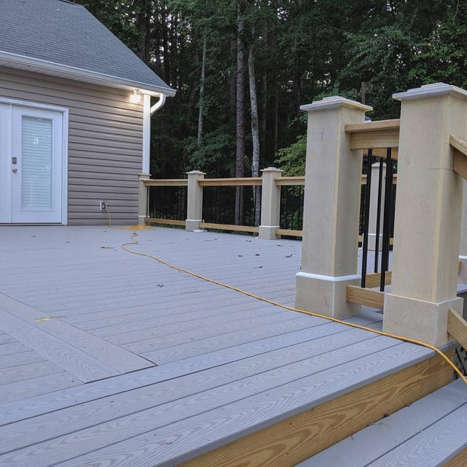 A deck with stairs leading up to a house
