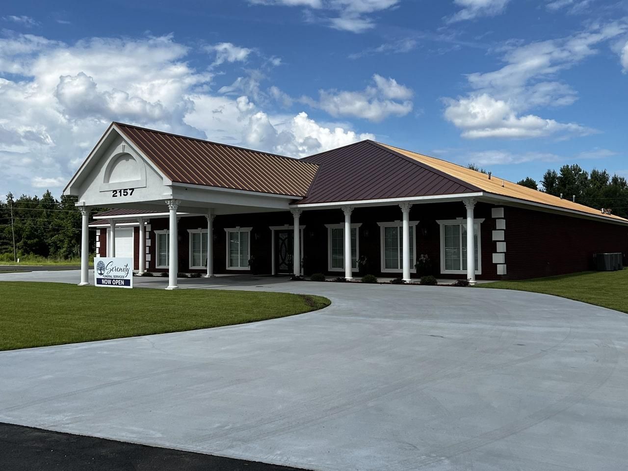 a large house with a driveway leading to it