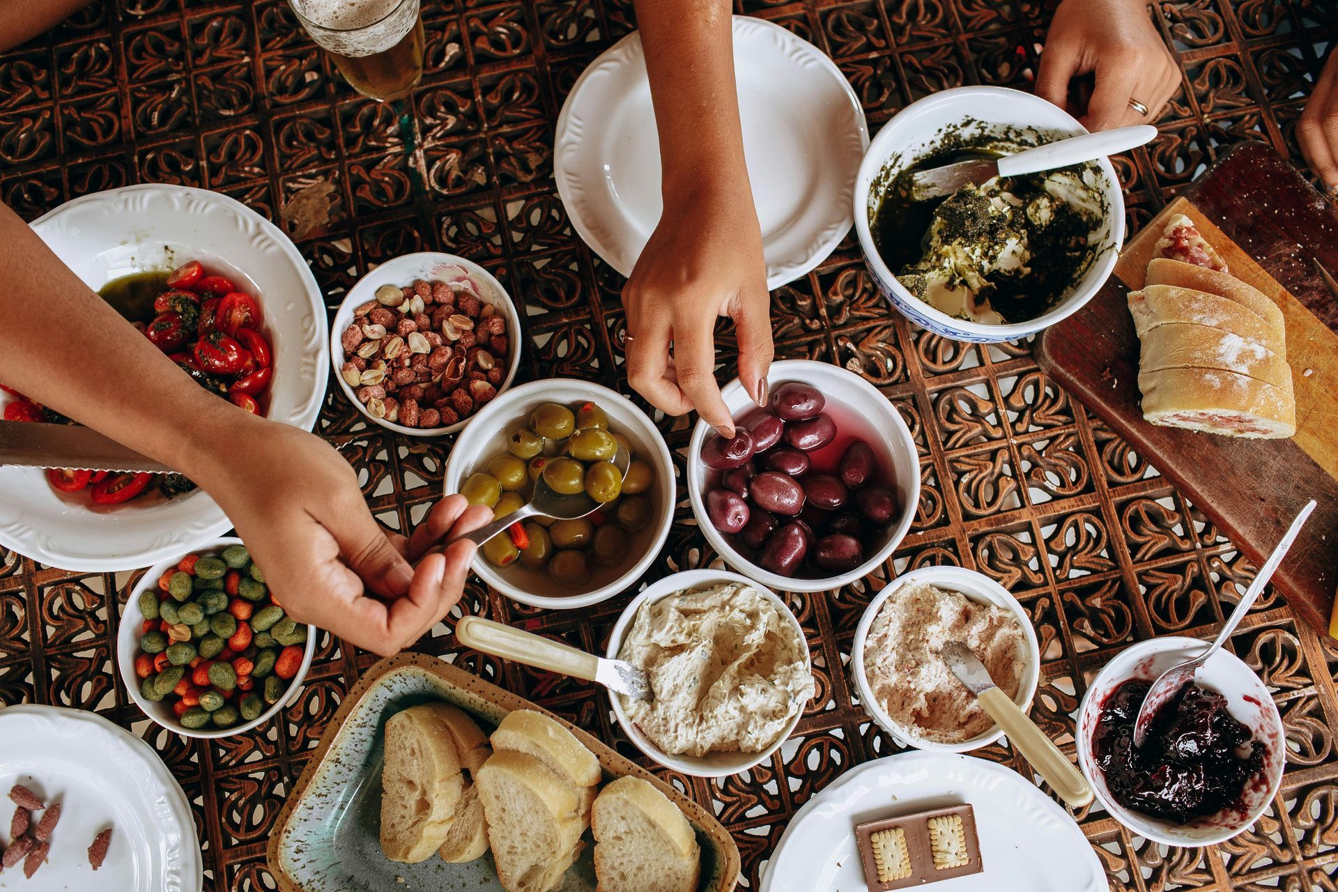 A group of people are sitting at a table with bowls of food.